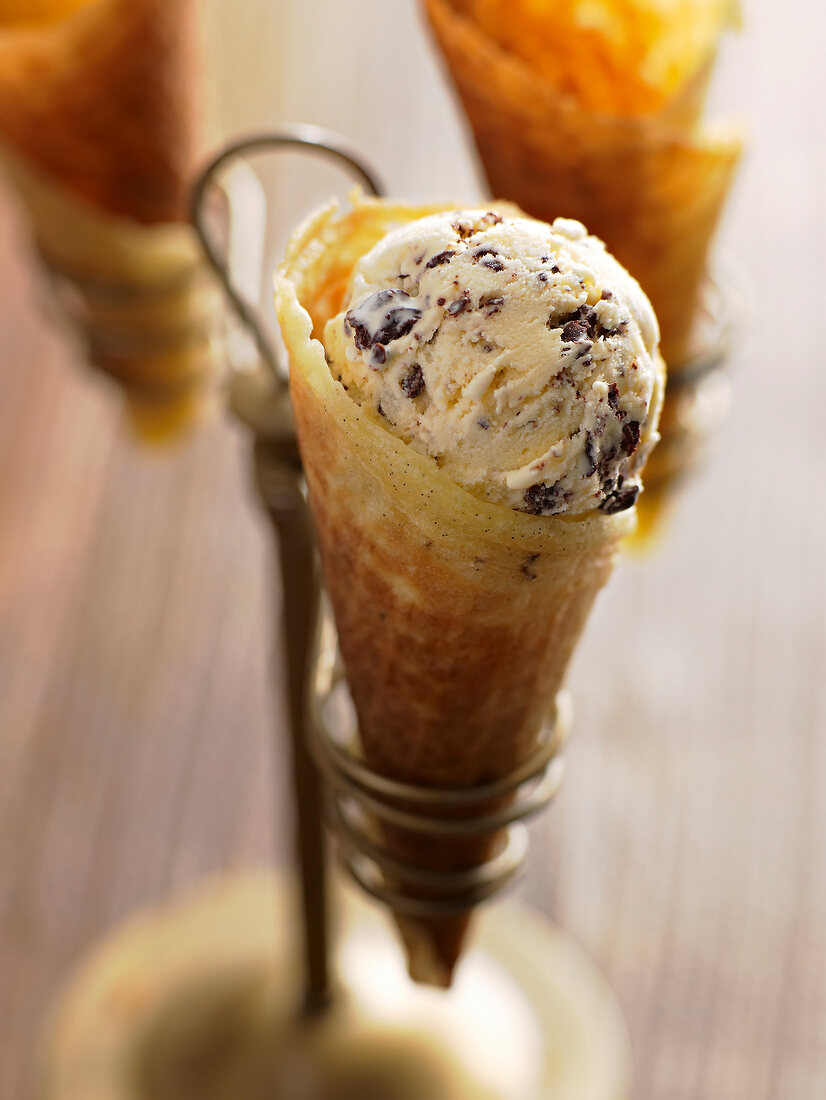 Close-up of stracciatella ice-cream with vanilla-rum waffles on stand