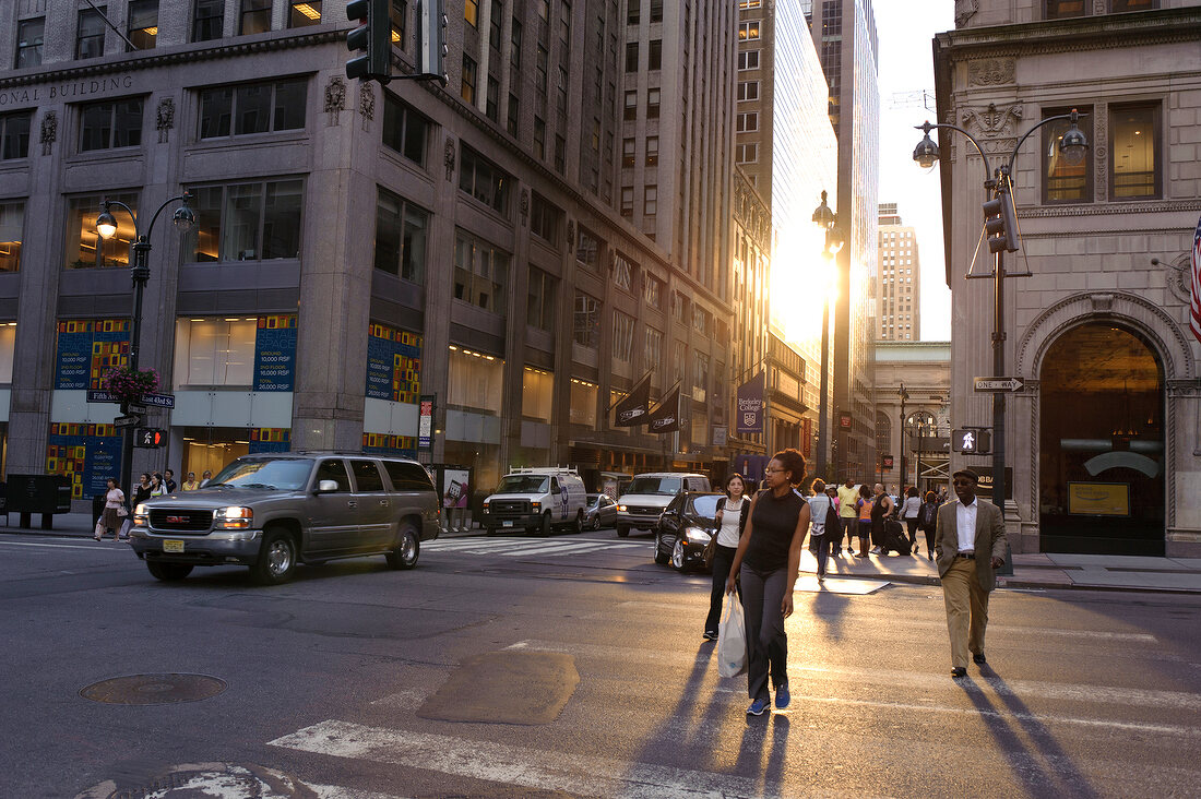 People walking on the crossing near Central Park, New York, USA