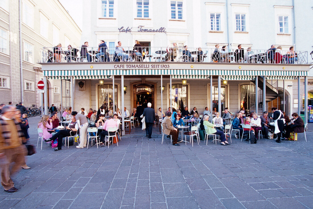 People having food at Cafe Tomaselli in the Alter Market, Salzburg, Austria