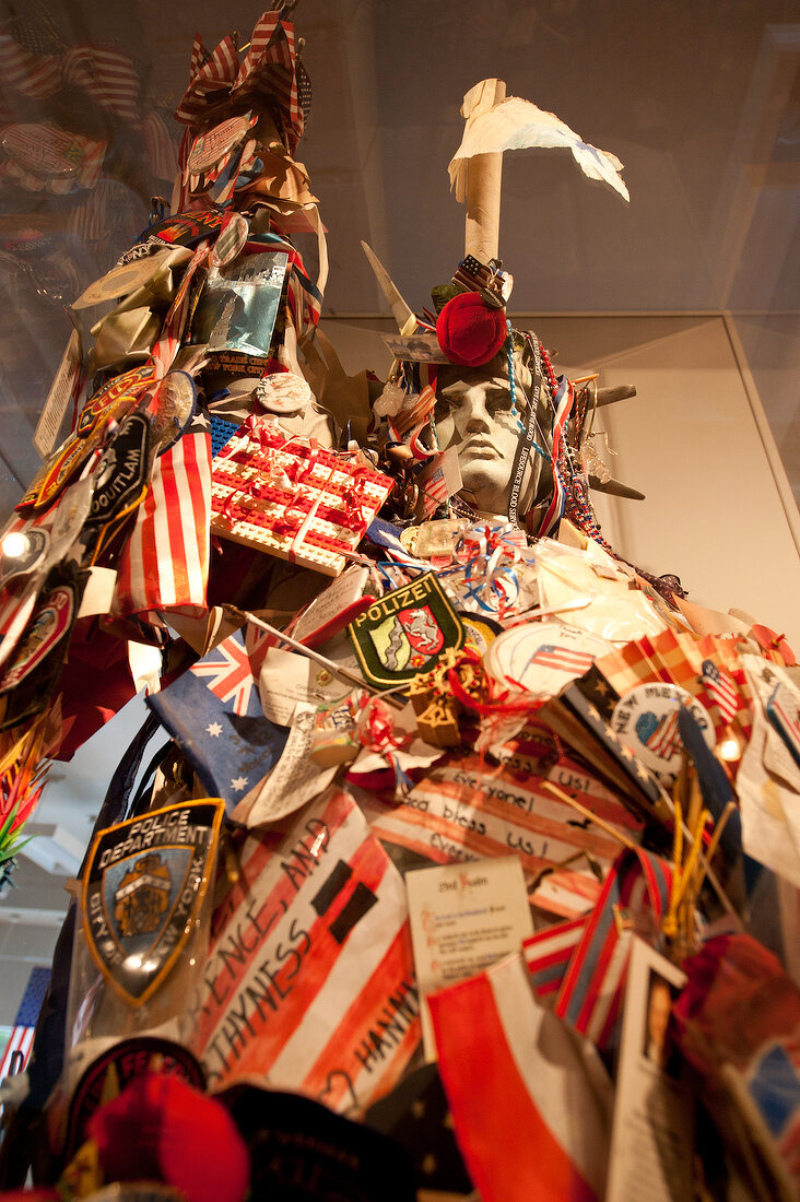 Replica of Statue of Liberty covered with flags at 9/11 Memorial Museum, New York