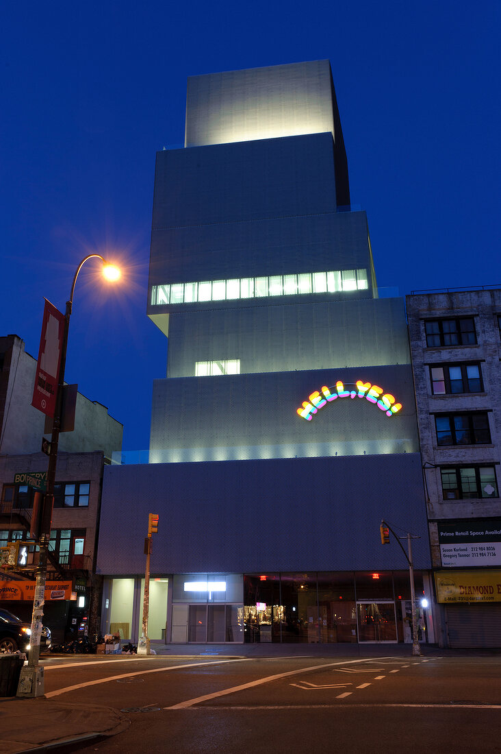 Facade of New Museum at night with street lights, New York, USA