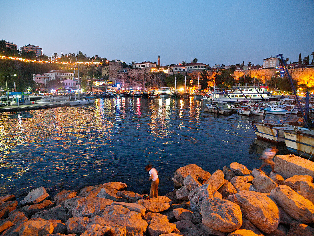 View of boats moored at port at dusk, Antalya, Turkey