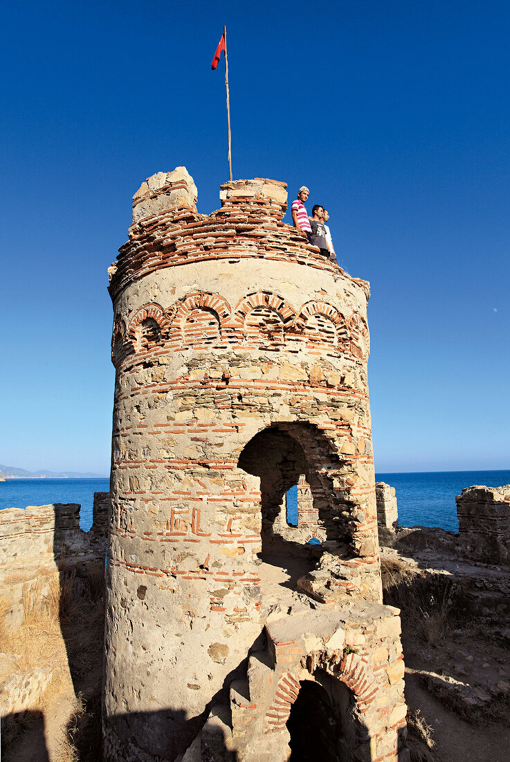 Tourists on tower of Mamure Castle in Anamur, Mersin Province, Turkey