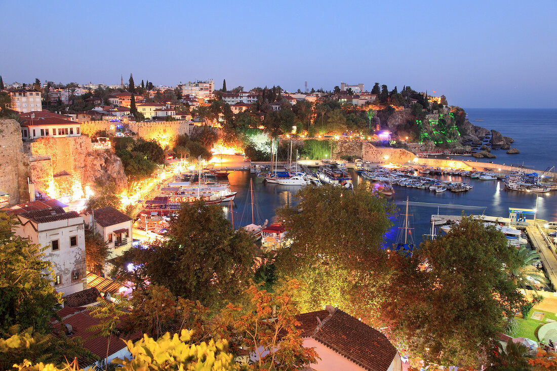 Boats moored in Old Town harbour at night in Antalya, Turkey