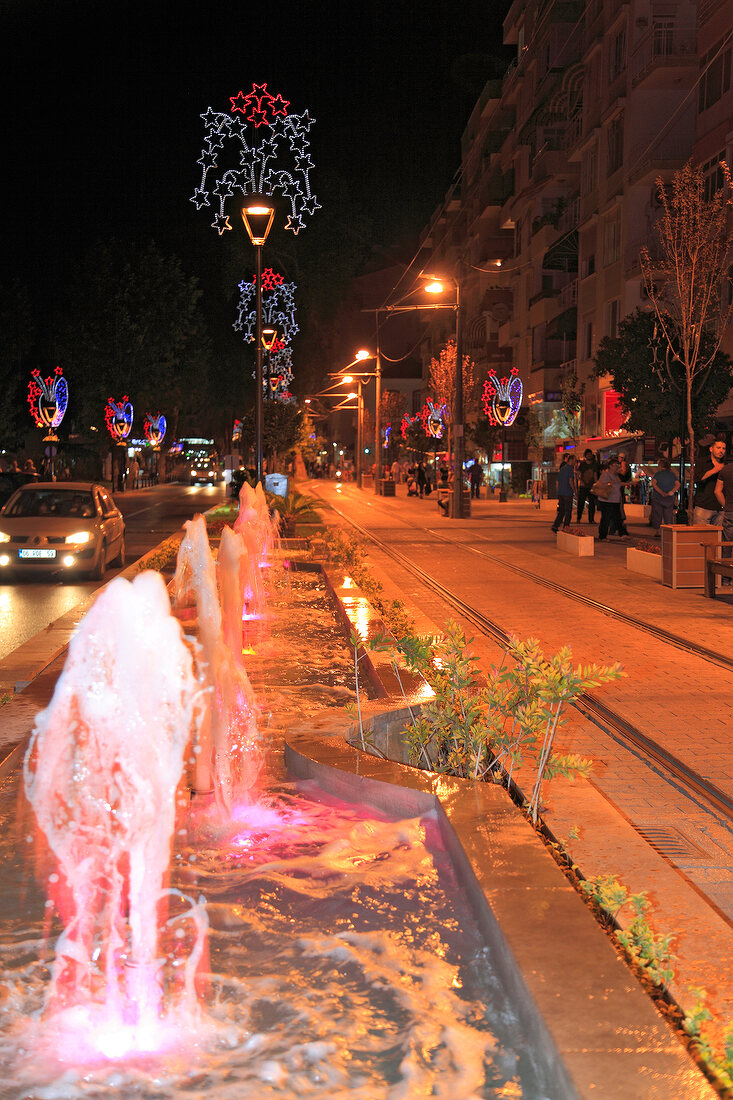 Fountains and street lights of Cetinkaya Caddesi street at night, Antalya, Turkey