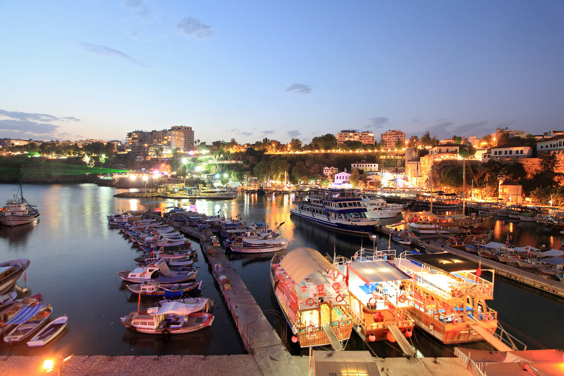 Boats moored in Old Town harbour at night in Antalya, Turkey