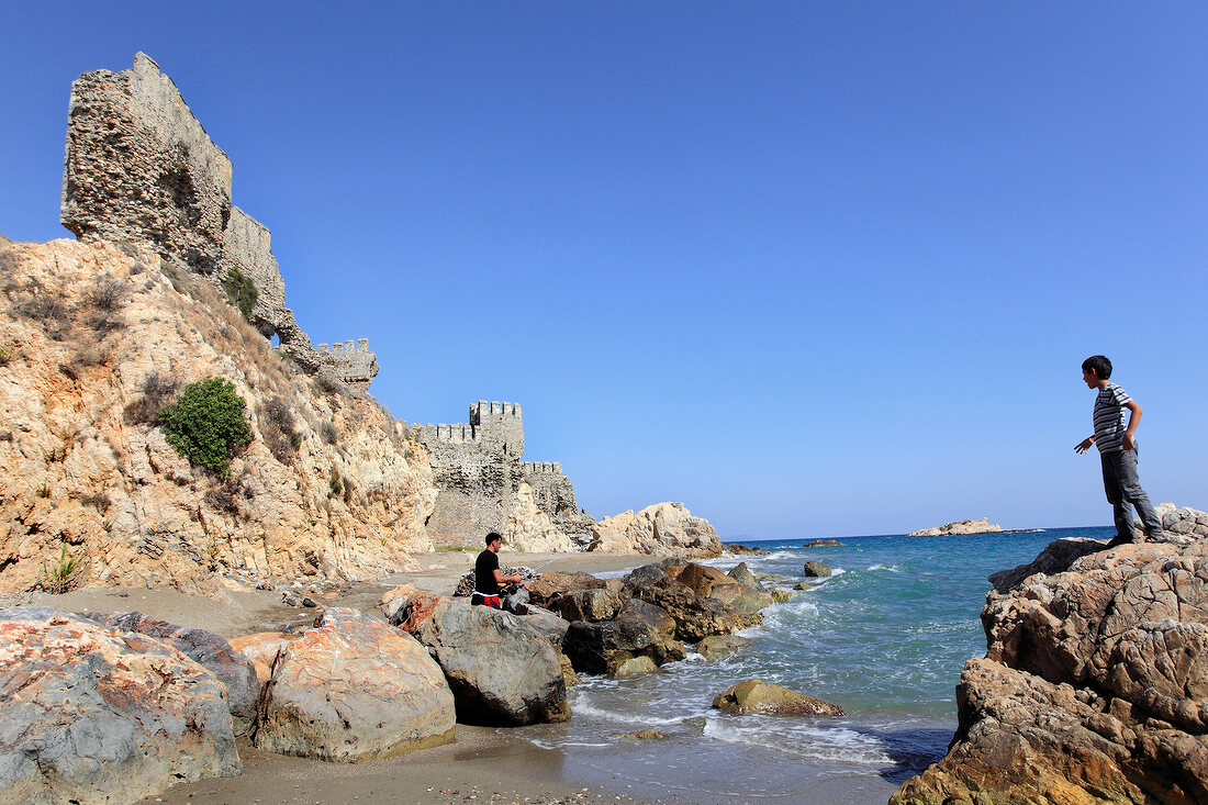 Children near sea at Mamure Castle in Anamur, Mersin Province, Turkey