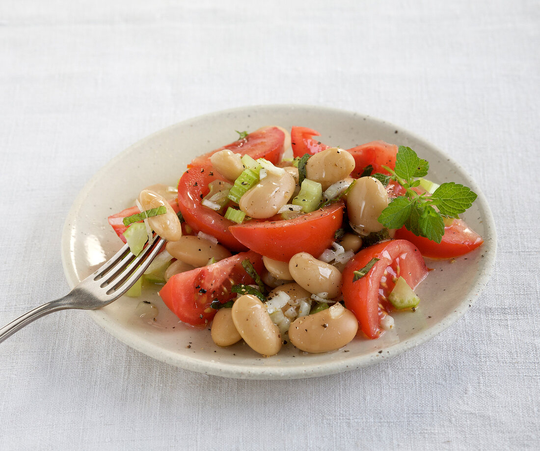 Tomato and bean salad on plate