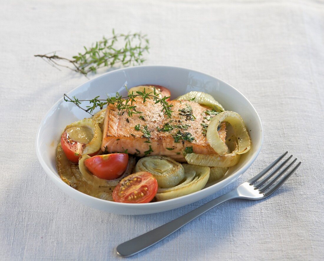 Salmon fillet on a fennel and tomato medley