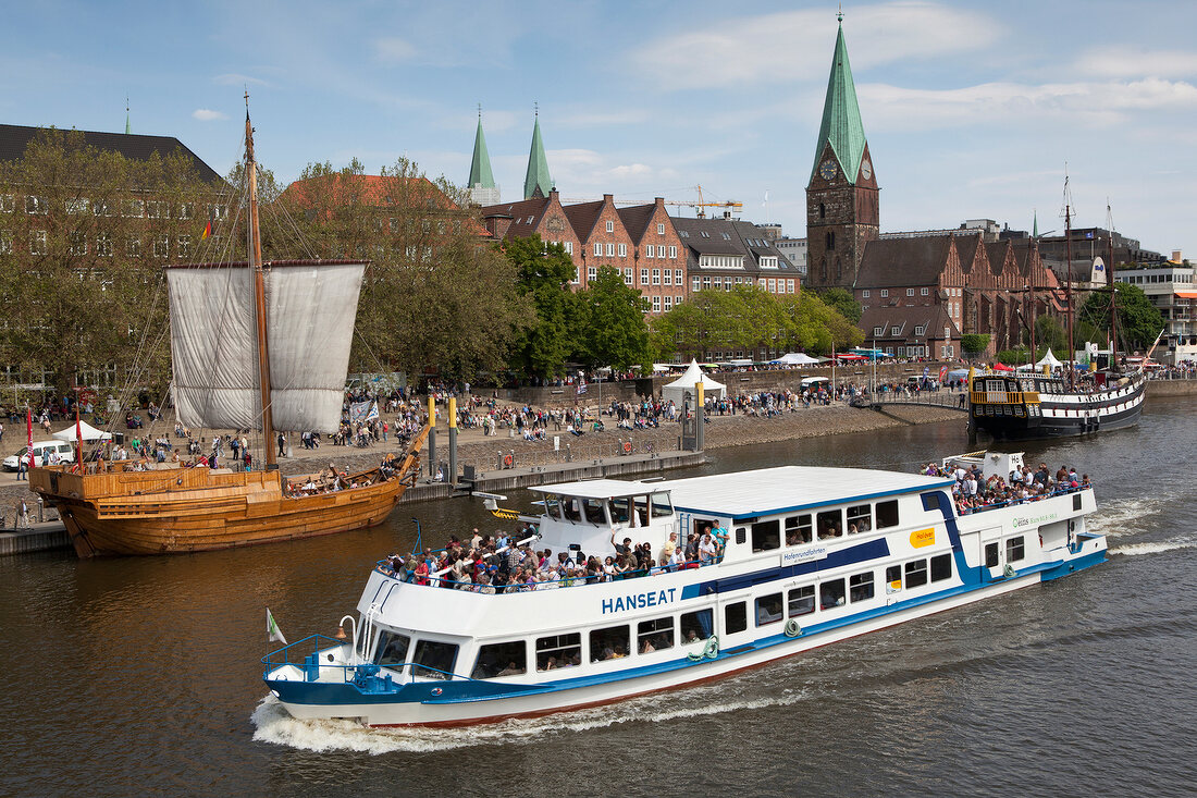 People in ship in Wesser river, Bremen, Germany