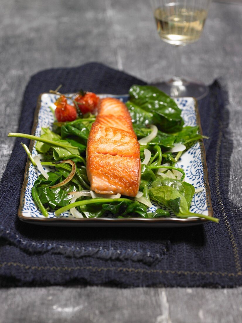 Salmon fillet on a bed of spinach