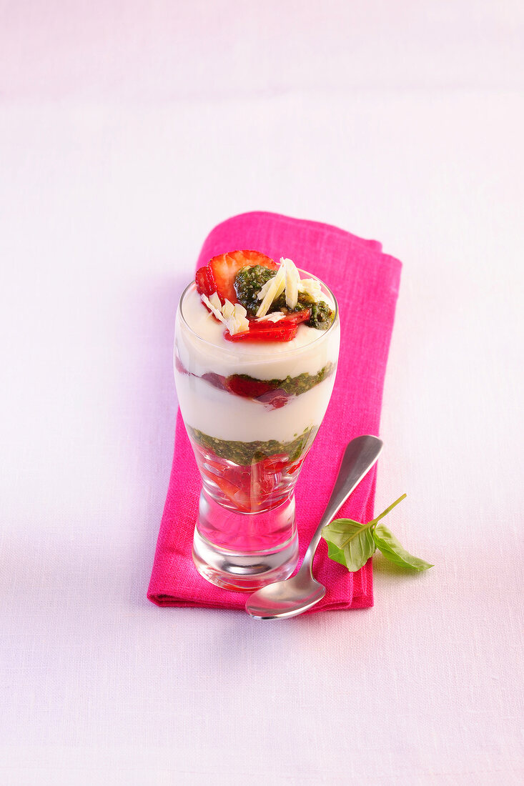 Yogurt cream with sweet pesto in glass