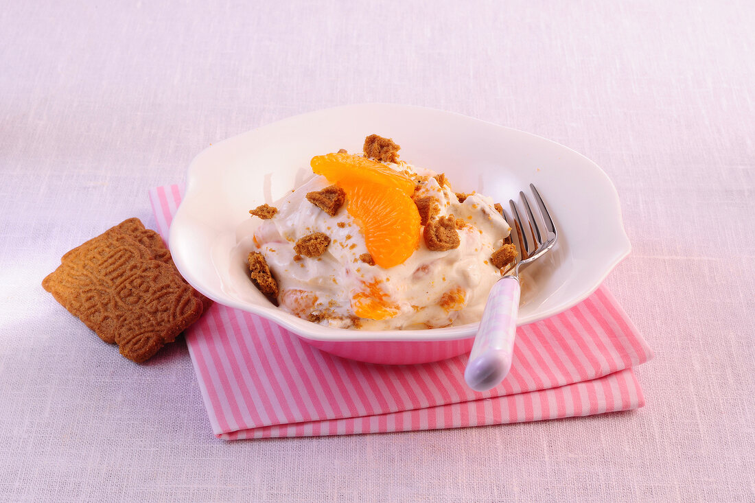 Mandarin Curd with pieces of cookies in serving dish