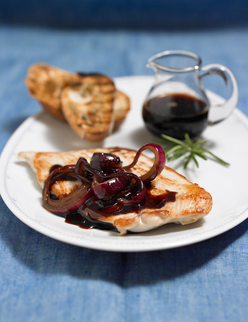 Close-up of balsamic steak with spicy onions on plate