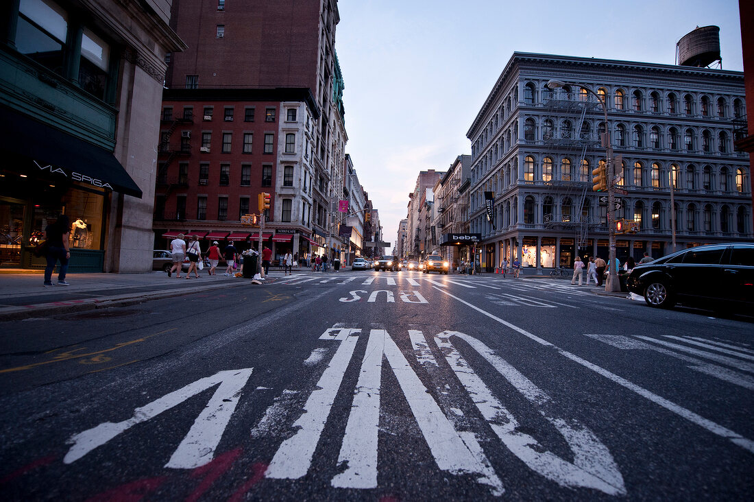 Low angle view of people at Broadway in SoHo, New York, USA