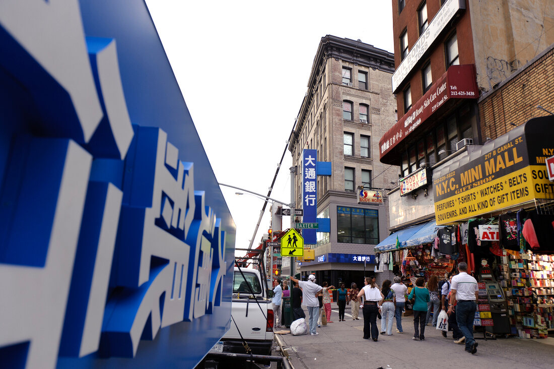 View of people in front of shops in Baxter Street at Chinatown, New York, USA