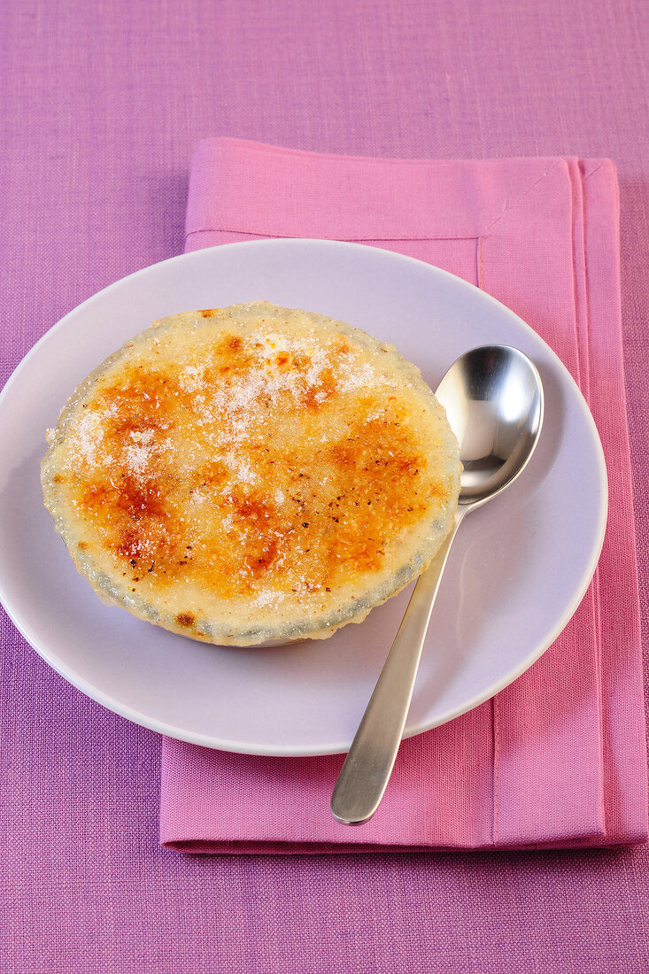 Baked semolina pudding with nuts and apricots on plate