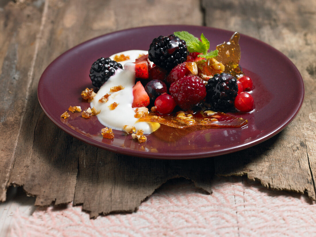 Beer cream with walnut brittle on plate