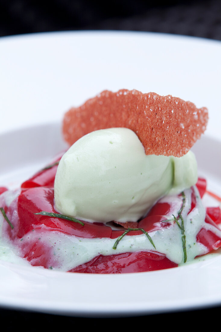 Close-up of raspberry ravioli with ice on plate