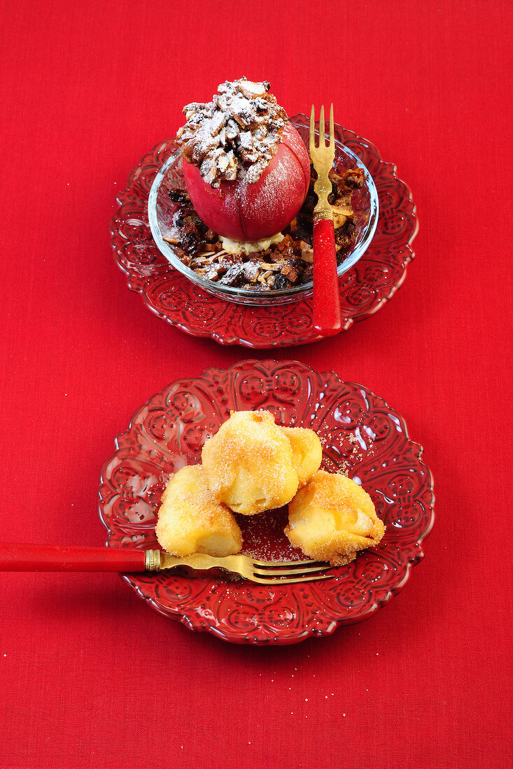 Pear donuts on plate and baked apple in bowl