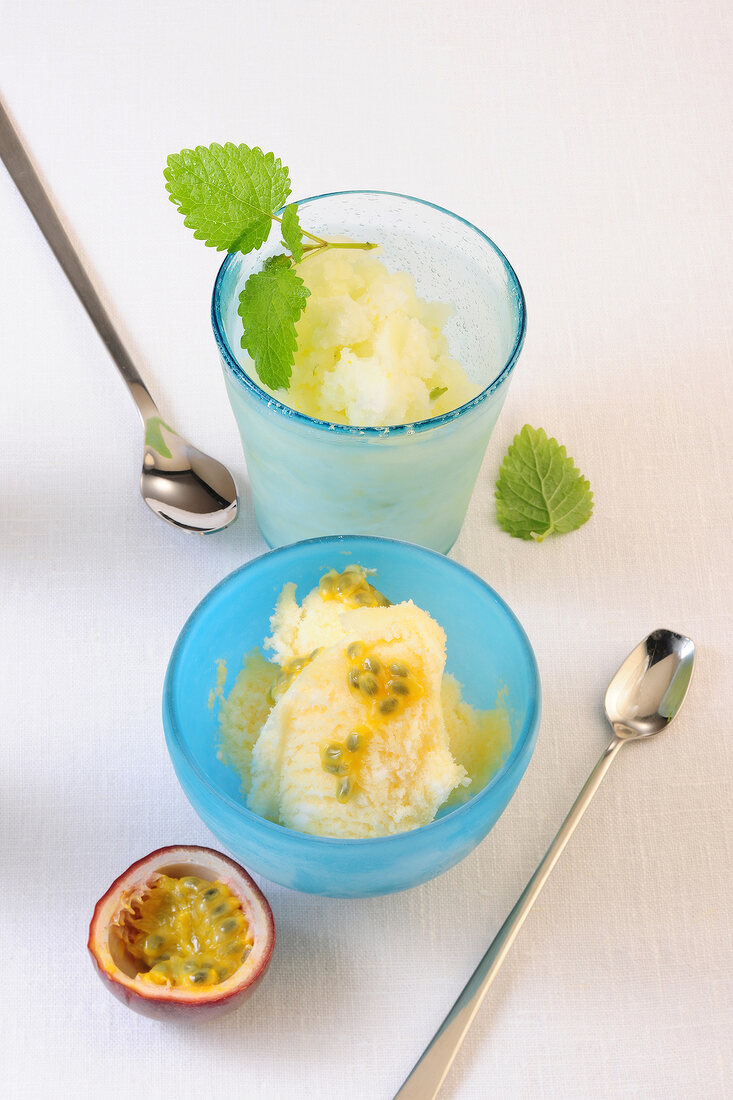 Lemon balm sorbet in bowl and prosecco with fruit sorbet in glass