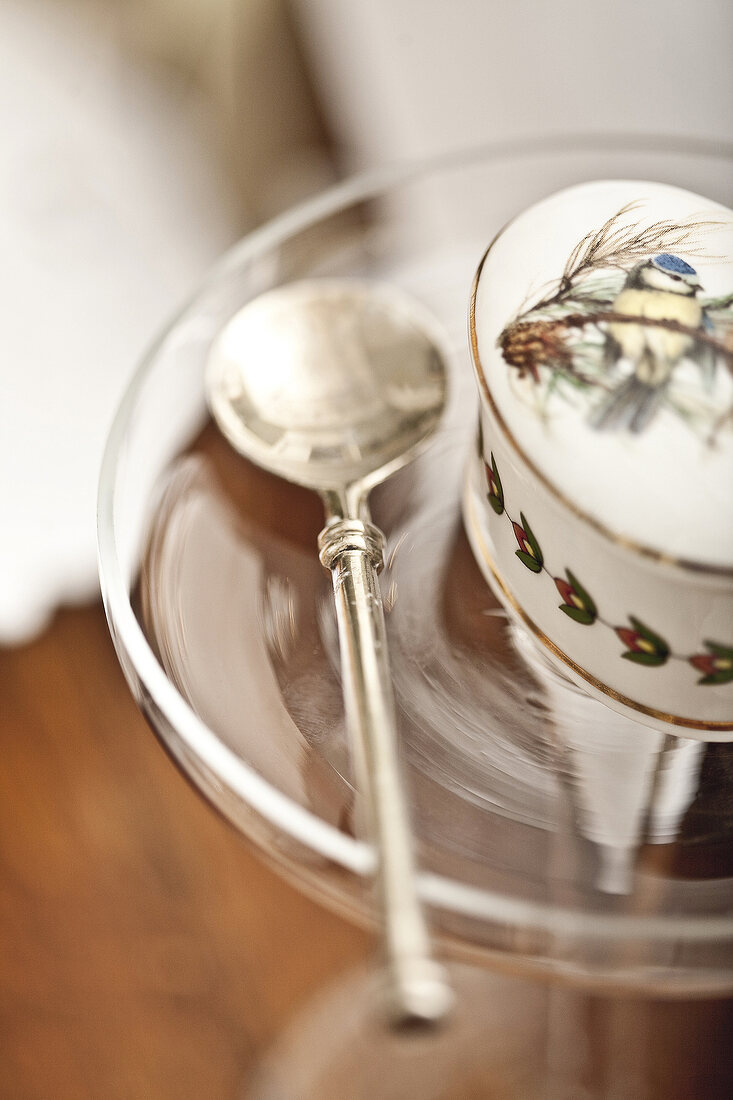 Close-up of porcelain cup and saucer with spoon