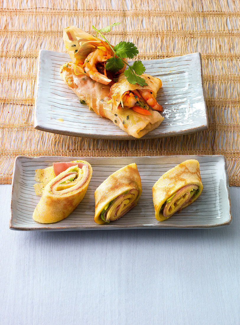 Rice paper rolls and pancake rolls in serving dishes