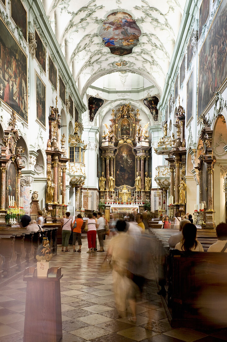 People inside St. Peter's Abbey at Salzburg, Austria, blurred motion