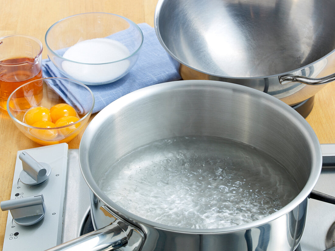 Boiling water in pan for preparation of zabaglione, step 1