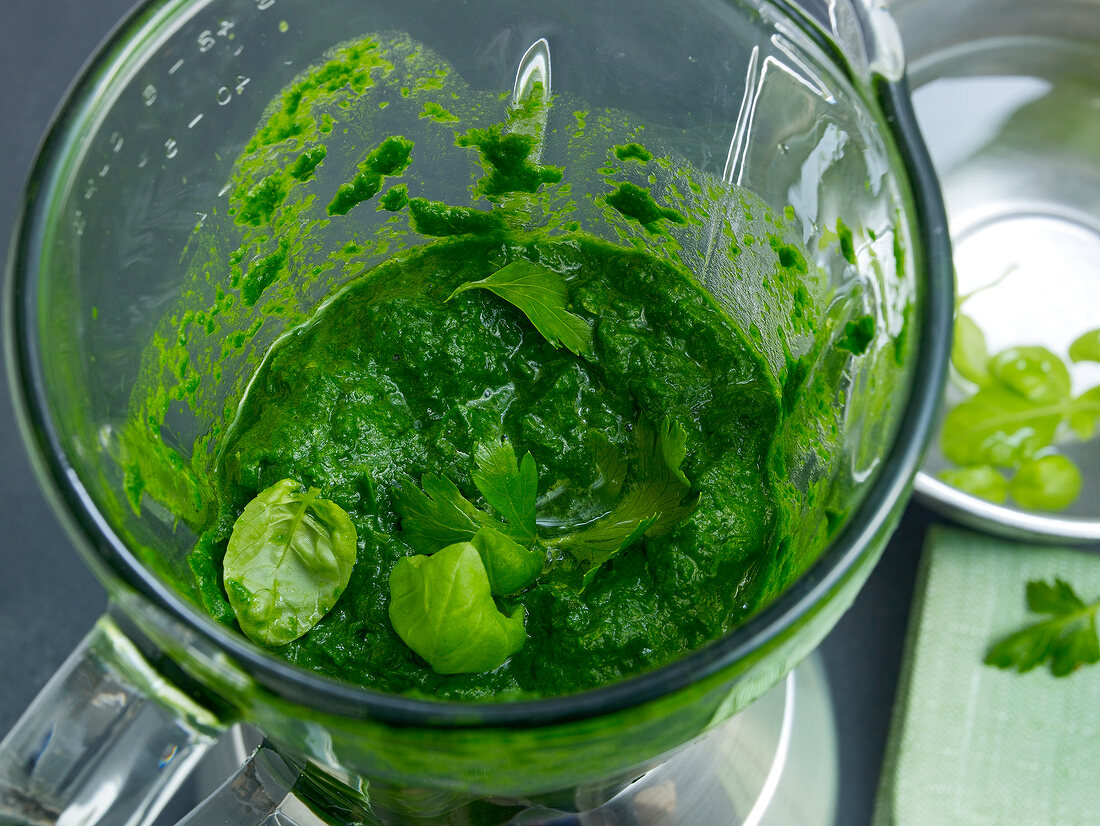 Close-up of herb puree in mixer jar, step 2