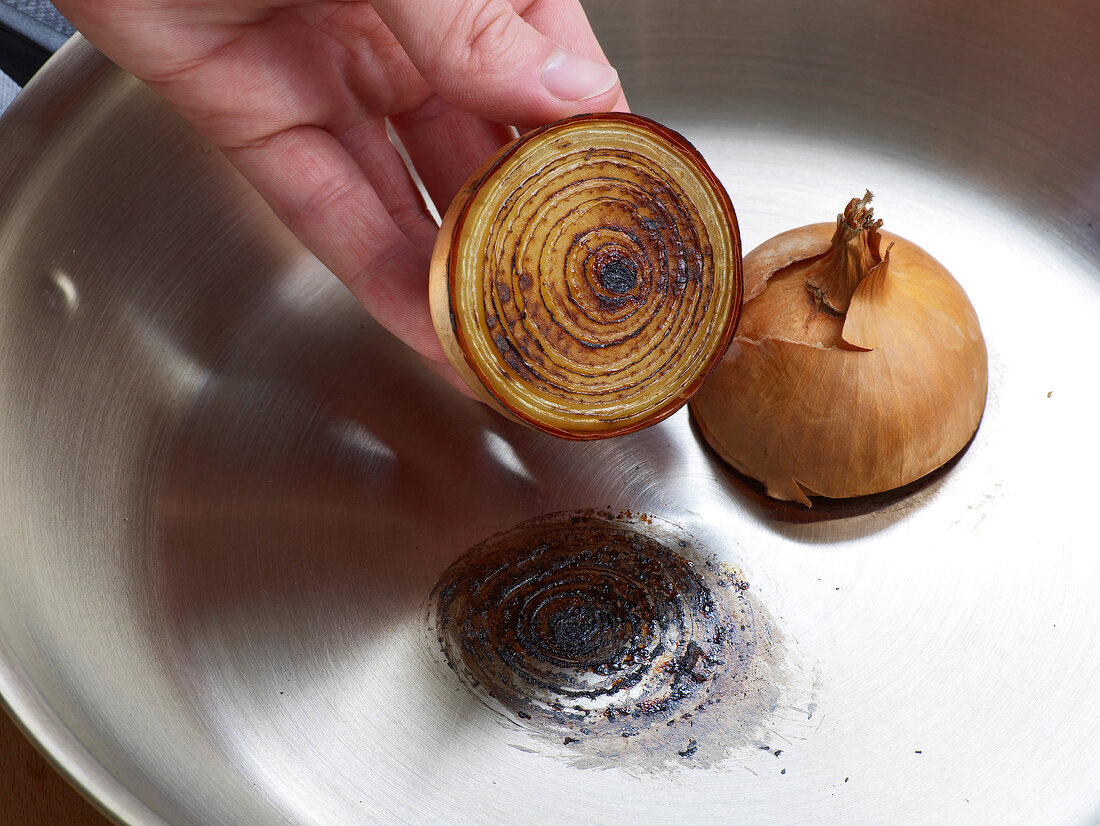Burning raw onions in frying pan