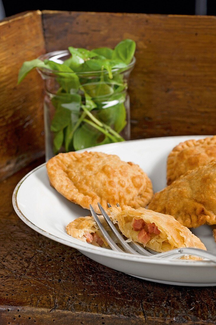 Tirteln (deep-fried pastries from South Tyrol) filled with sauerkraut and bacon (South Tyrol)