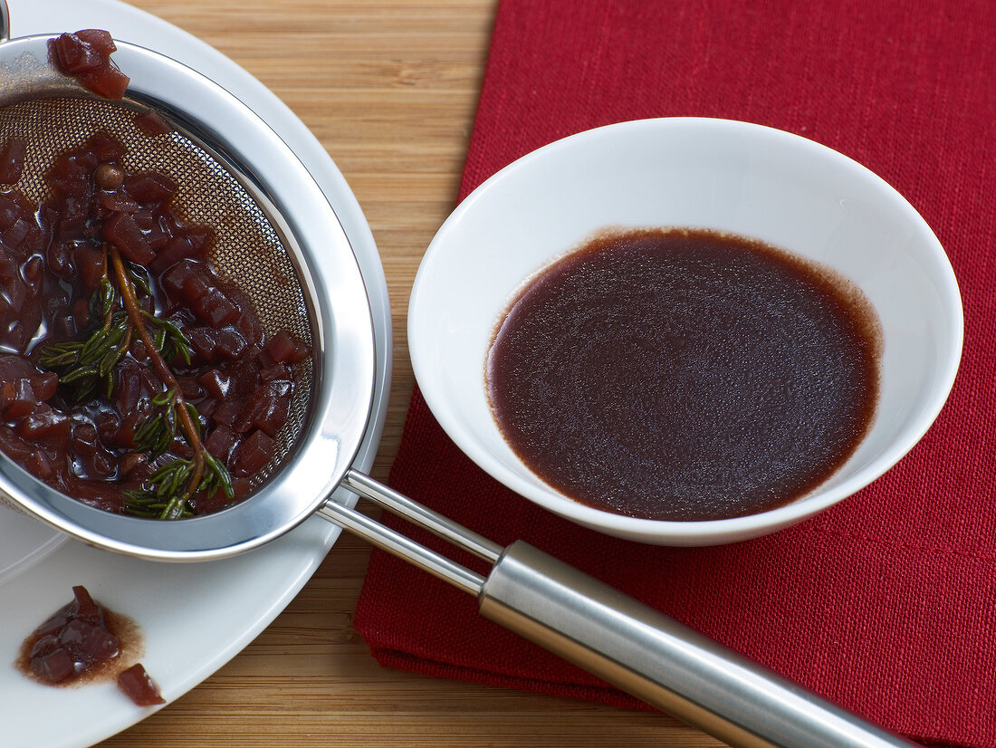 Reduced red wine sauce in bowl, step 3