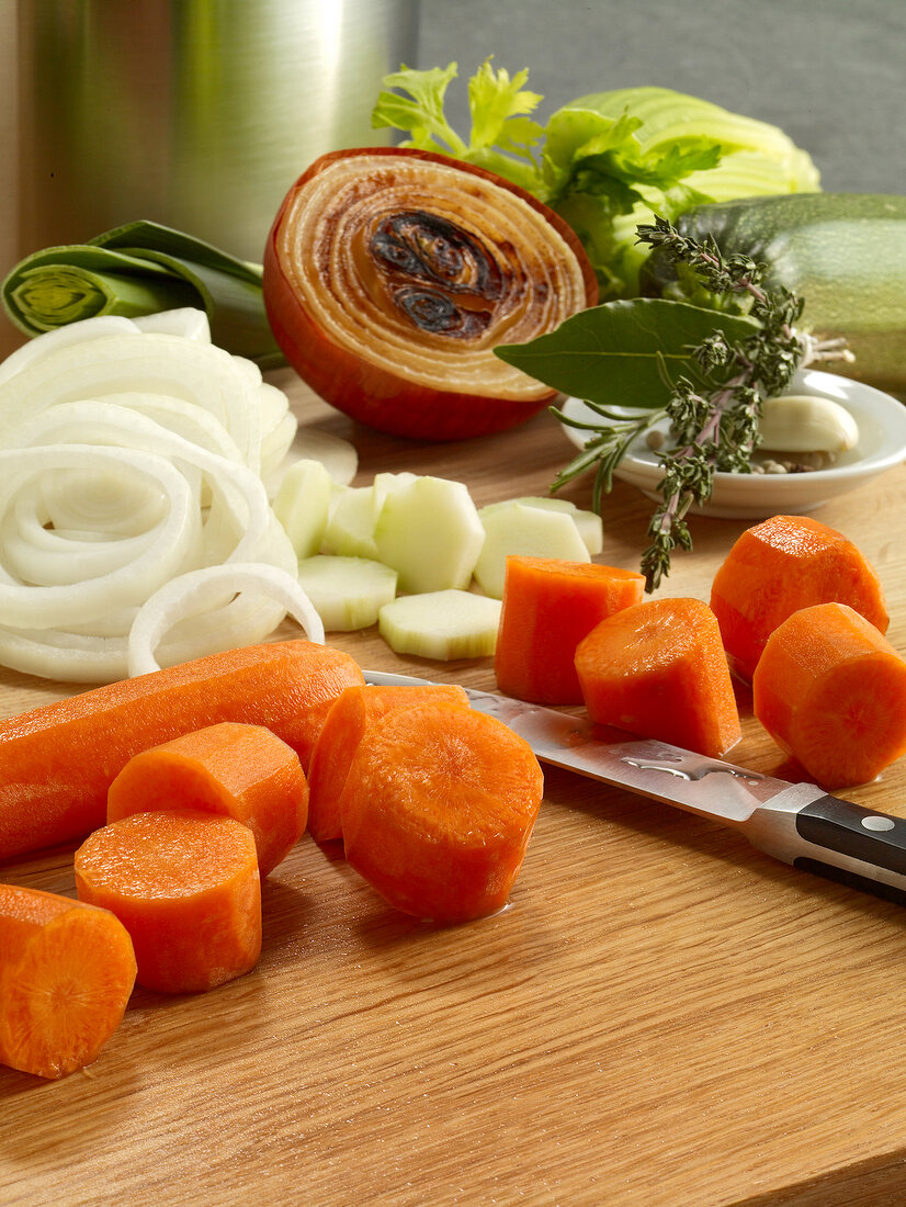 Various diced vegetables on wooden board