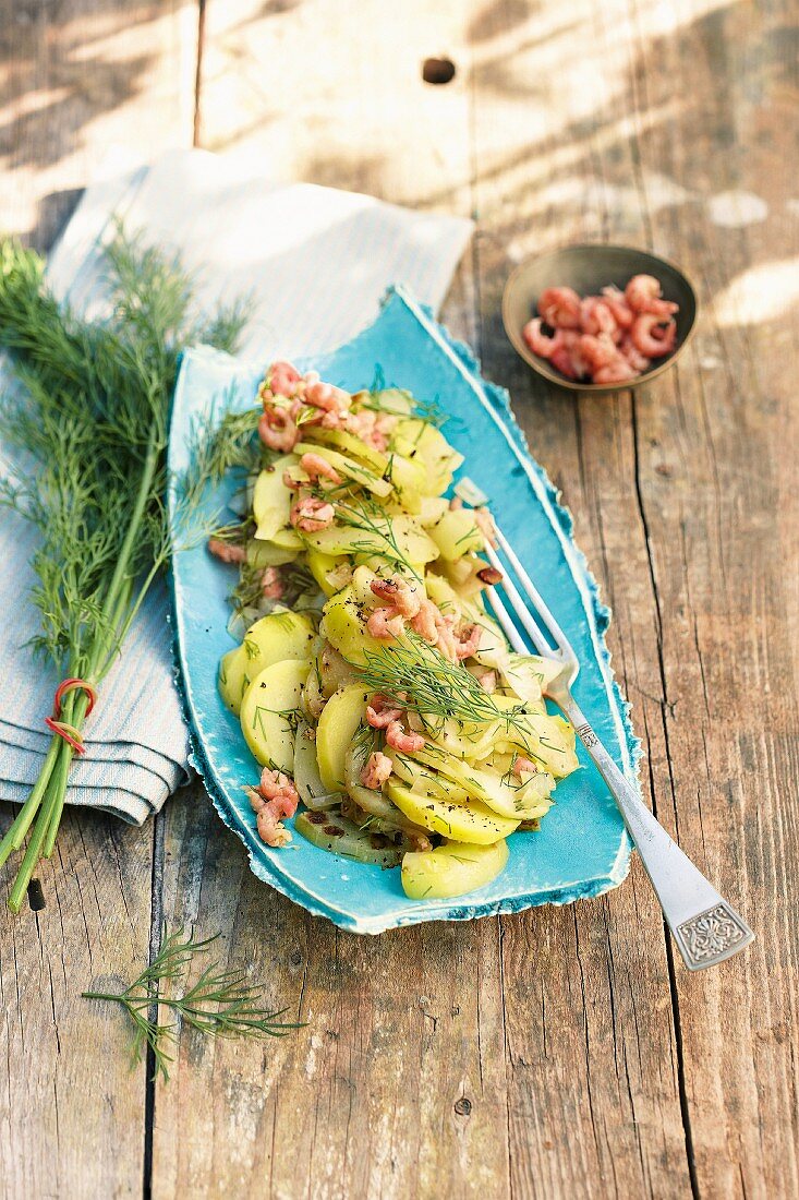 Potato salad with cucumber and shrimps