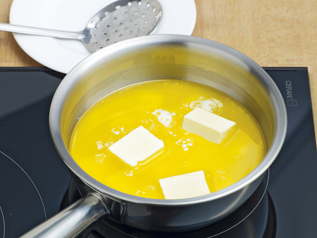 Butter being clarified in pan, step 1