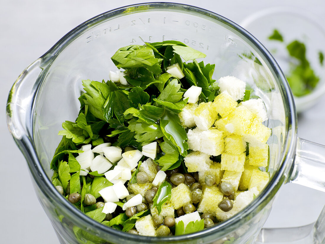 Ingredients for salsa verde in grinder, step 3