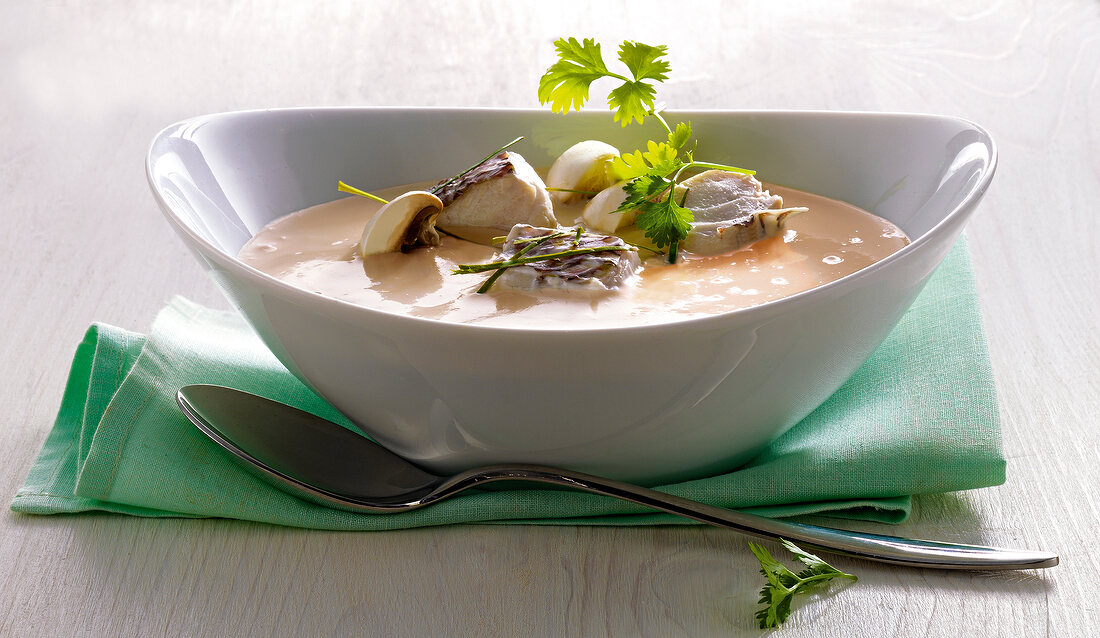 Close-up of fish soup with lemongrass and galangal in bowl