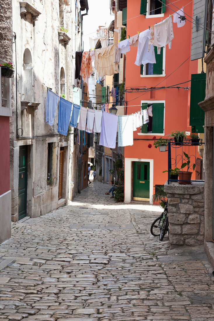 Street with clothes on cable line at Rovinj, Croatia