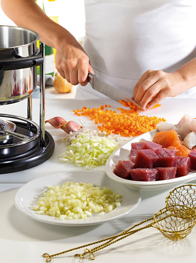 Close-up of hand chopping vegetables