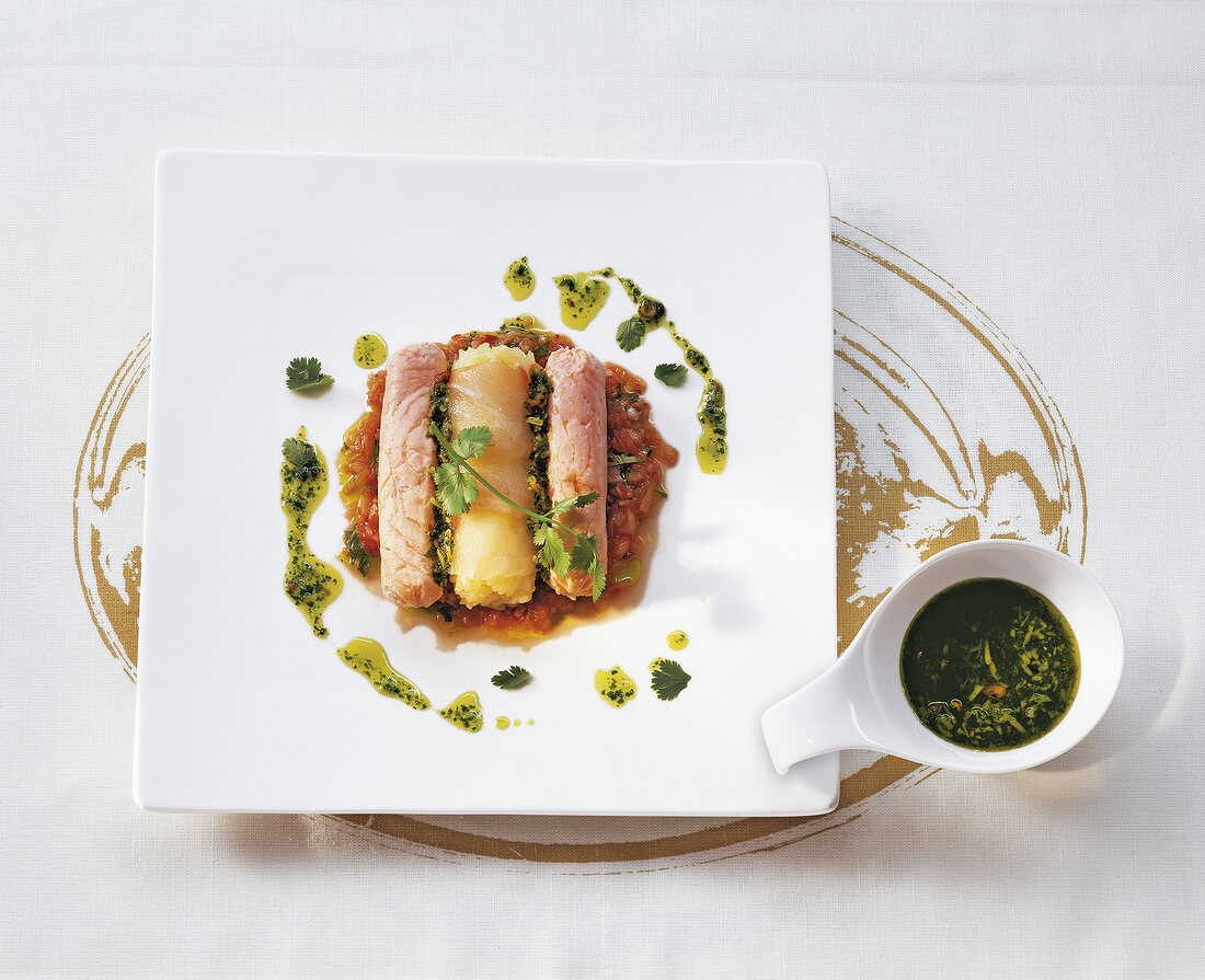 Carpaccio of sea bream with lime vinaigrette on square plate