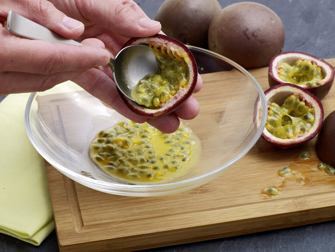 Passion fruit seeds being removed for preparation of passion fruit sabayon, step 1
