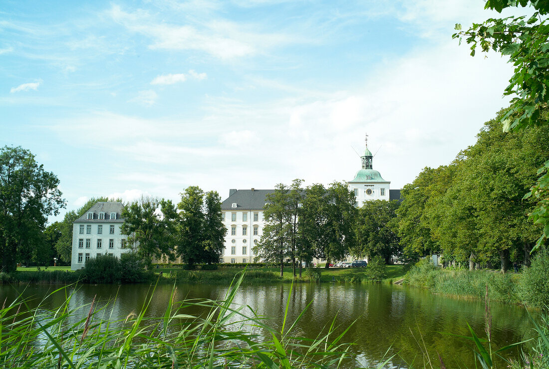 View of Gottorf Castle surrounded with greenery at Schleswig, Schleswig-Holstein, Germany