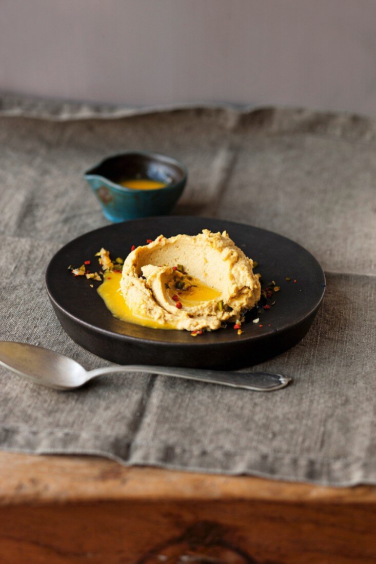 Hummus with saffron, oranges and pistachio nuts