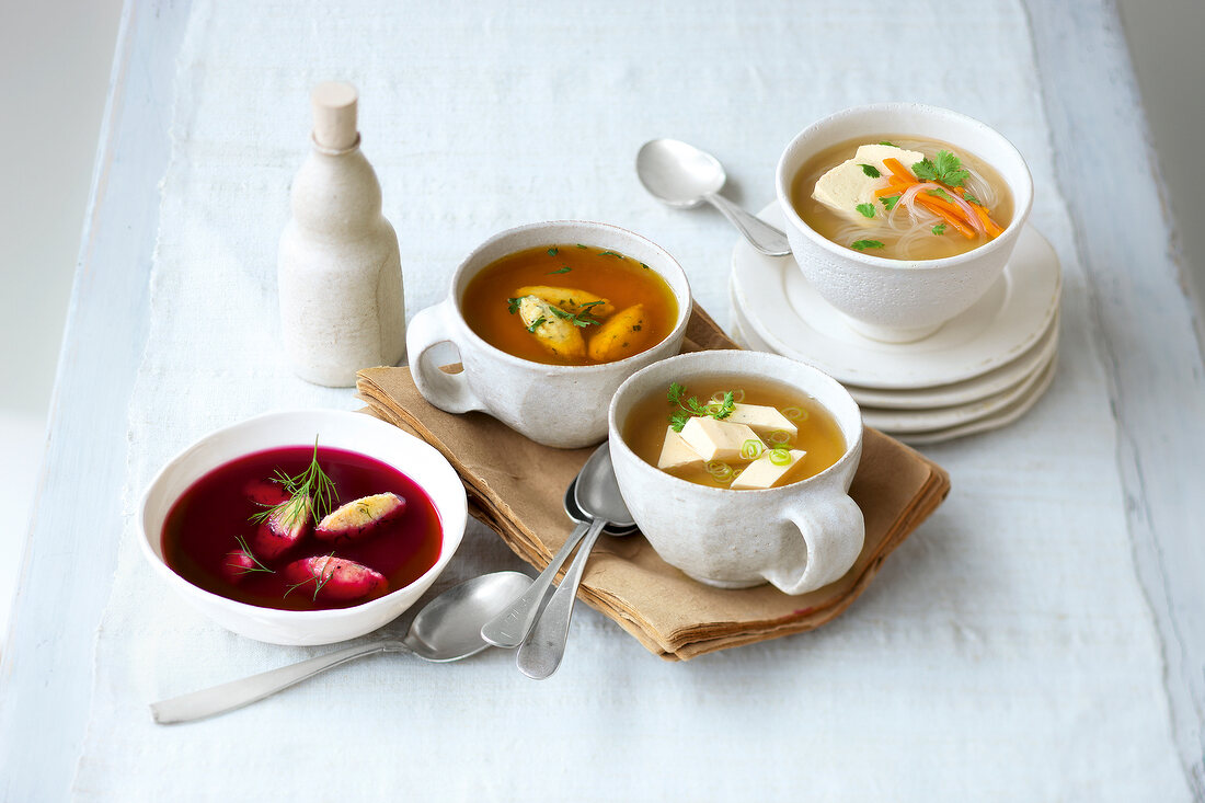 Various broths in four bowls