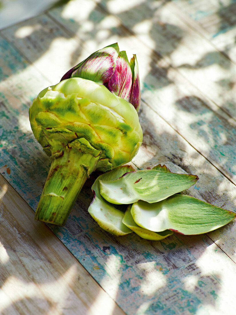 Close-up of artichoke on wood