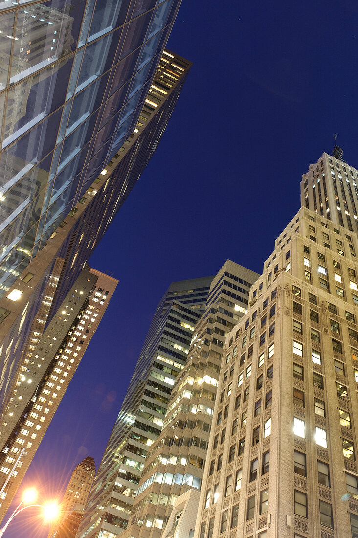 Illuminated skyscrapers at night on Park Avenue at New York, USA