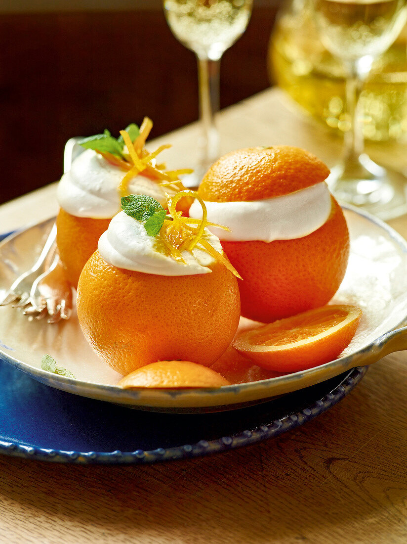 Stuffed oranges on plate, garden kitchen