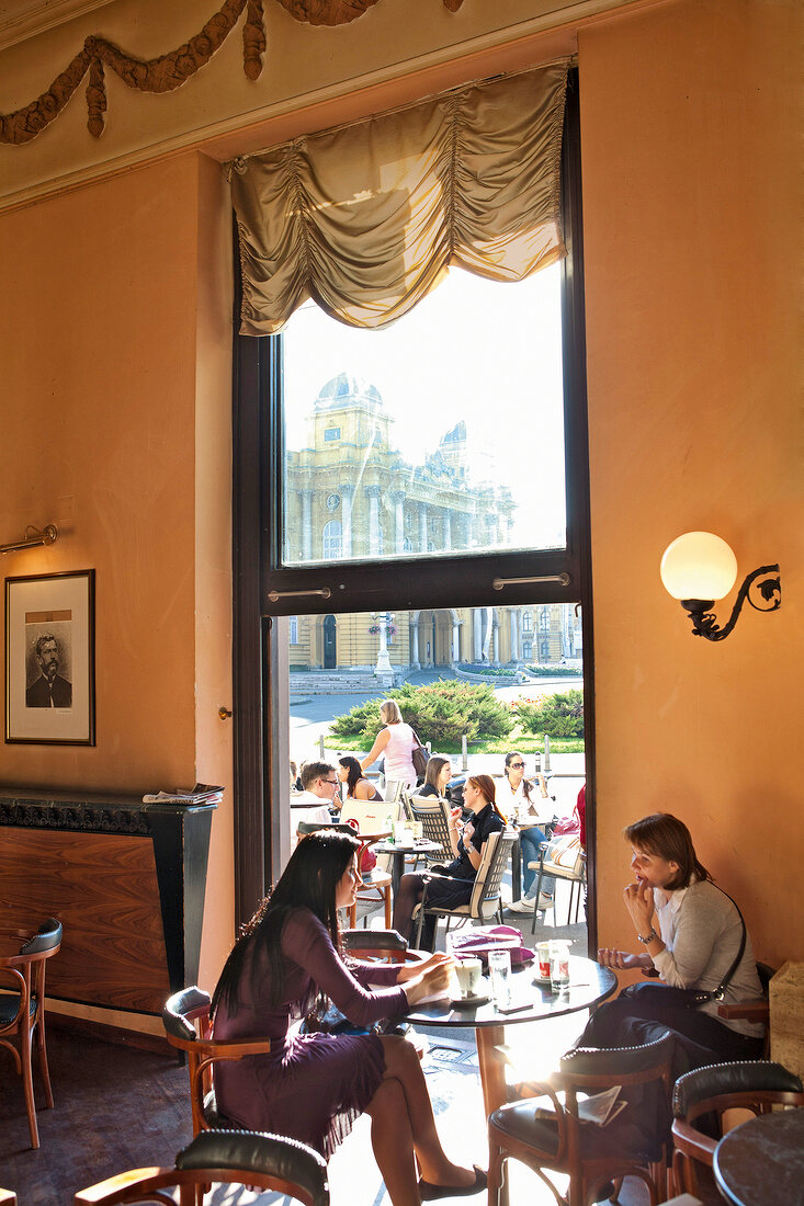 Guest sitting in cafe Kazalisna Kavana at Zagreb, Croatia