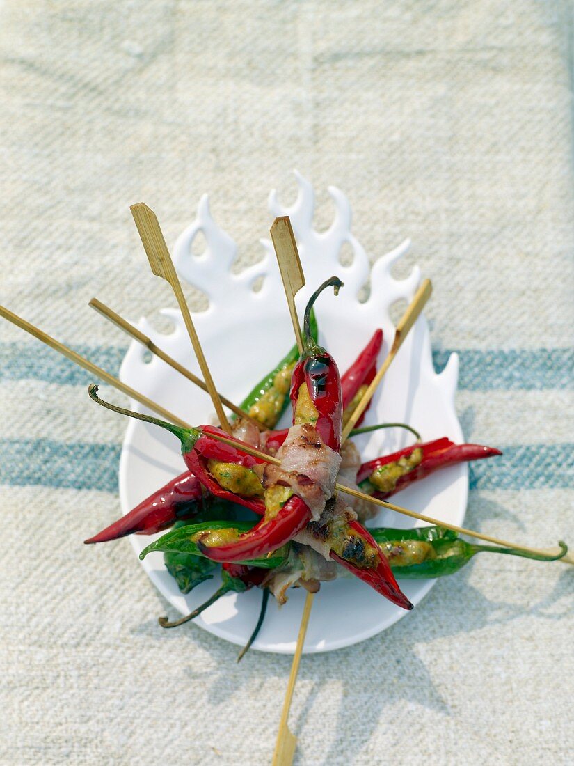 Stuffed hot chilli peppers on skewers